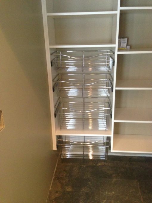 Walk-in Pantry with pull-out baskets to help keep the small things organized